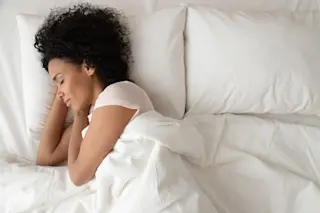 woman sleeping in bed with Trex arms