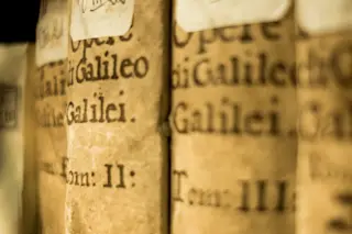 Close-up of aged book spines showing Galileo's collected works Close-up of aged book spines showing Galileo's collected works