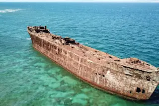 A rusty shipwreck off the coast of ShipWreck Beach on the Island of Lanai A rusty shipwreck off the coast of ShipWreck Beach on the Island of Lanai