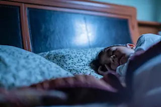 child-sleeping-in-a-bed