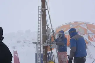 research-team-digging-in-glacier