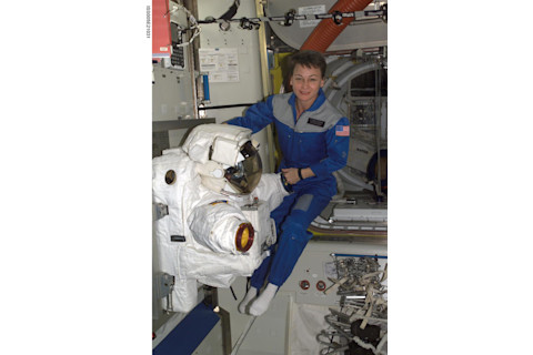 Astronaut Peggy Whitson floats in the Quest/Airlock during Expedition Five on the ISS