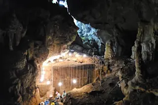Local archaeologists excavating in the Tam Pà Ling cave, Laos.