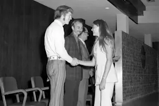 Student Kathy L. Jackson wearing pants as she greets Astronauts and MSFC Personnel(L-R); ASTRONAUTS Rusty Schweickart, Owen Garriott, and MSFC Skylab Program Manager Leland Belew. NASA/MSFC