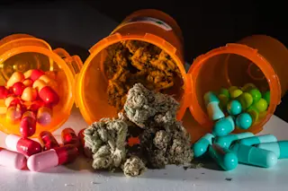 Pills and Marijuana in Prescription Drug Bottles - Shutterstock