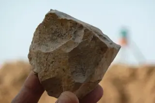An Oldowan core freshly excavated at Ain Boucherit from which sharp-edged cutting flakes were removed. [Credit: M. Sahnouni