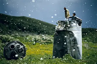Villagers collecting scrap from a crashed spacecraft, surrounded by thousands of white butterflies. Environmentalists fear for the region's future due to the toxic rocket fuel. (Credit: Jonas Bendiksen/Magnum)