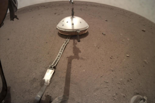 NASA’s InSight lander has its seismic instrument tucked under a shield to protect it from wind and extreme temperatures. (Credit: NASA/JPL-Caltech)