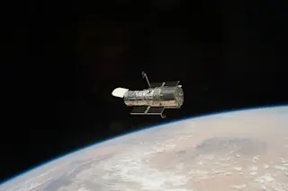Hubble Space Telescope floates above Earth