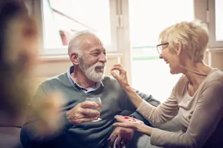 Old people taking medicine supplements pills - Shutterstock