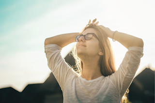 Woman With Hands on Head