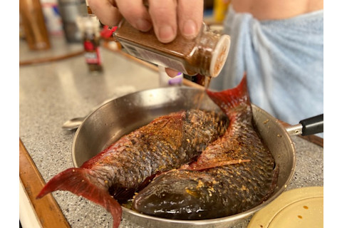 Parrot fish cooking on the stove