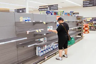 shopper coronavirus empty shelves - Shutterstock