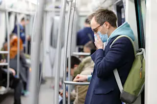 man coronavirus mask public transportation - shutterstock