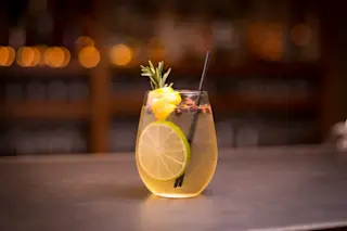 Delicious craft cocktail sitting on a bar - Shutterstock