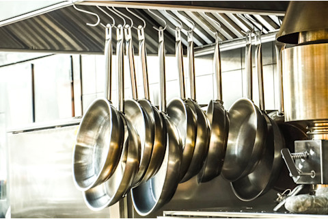 stainless steel pans hanging - shutterstock
