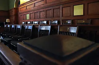jury box in the courtroom - shutterstock