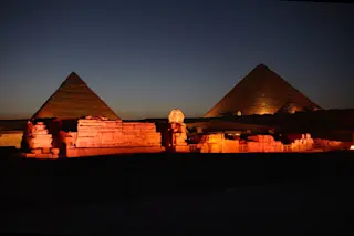 giza pyramid complex at night 