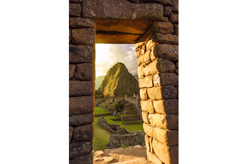inca doorway framing a mountain - shutterstock