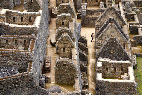 A man wanders through the ruins of Machu Picchu. (Credit: Russell Johnson/Shutterstock)