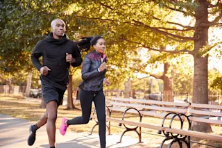 a young couple jogging in brooklyn - shutterstock
