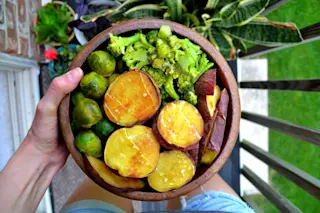 wooden bowl of veggies - shutterstock
