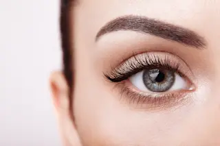 close up woman's eye - shutterstock 1224470146