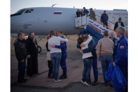 This is the moment that astronauts Alexey Ovchinin and Nick Hague were reunited with their families at the Baikonur Cosmodrome, after a flight back from their emergency landing zone. (Credit: NASA/Bill Ingalls)
