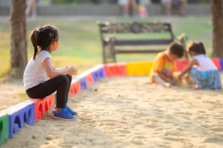 girl on playground alone