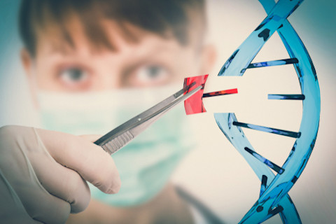 Hand of scientist replacing DNA - genetic engineering and gene manipulation concept
