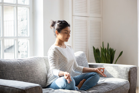 Female enjoying meditation to relax