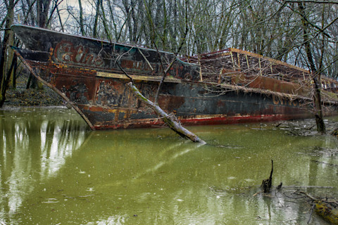 Petersburg, Kentucky / USA - February 1 2017: The USS Sachem abandoned ghost ship in Petersburg, Kentucky on murky Taylor Creek off the Ohio River
