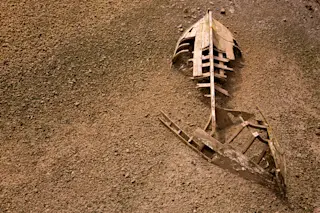 An old boat washed up on the shore