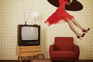 Woman wearing a red dress in a vintage living room traveling through time hole in celing