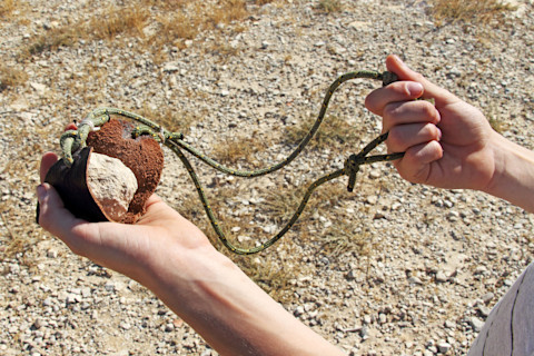Sling-for-stone-throwing-ancient-weapon-way-of-holding