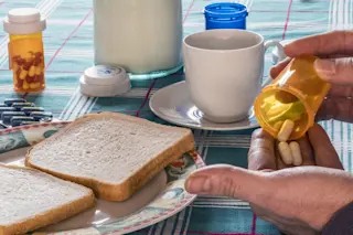 person taking medication with food