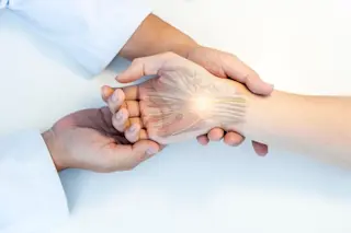 Doctor examining patient with carpal tunnel syndrome
