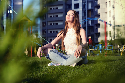 woman sitting in the park in the city