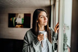 Woman thinking by a window