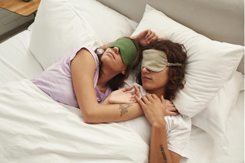 couple-sleeping-with-eye-masks