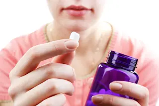 Woman taking magnesium supplement