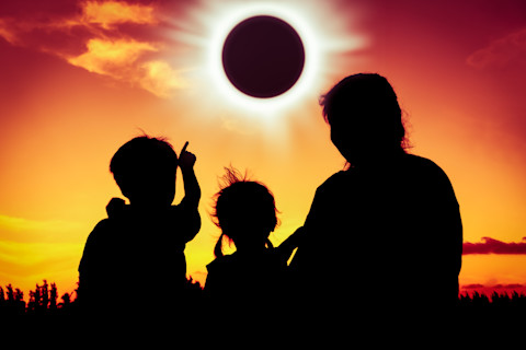 Family viewing solar eclipse