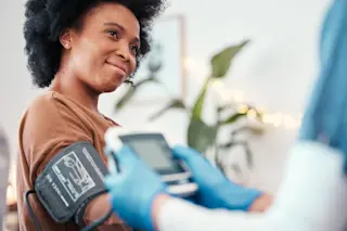 woman with blood pressure cuff