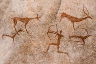 cave painting of people hunting