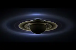 On July 19, 2013, in an event celebrated the world over, NASA's Cassini spacecraft slipped into Saturn's shadow and turned to image the planet, seven of its moons, its inner rings