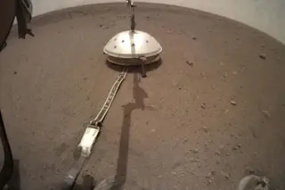 a small dome held by InSight's robotic arm on Mars