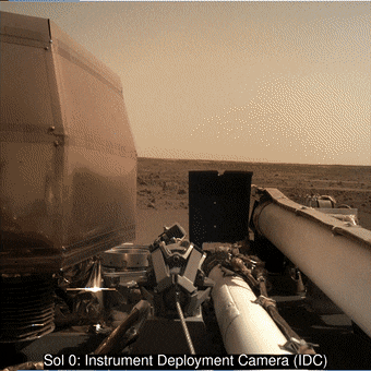 InSight's robotic arm carrying a camera around