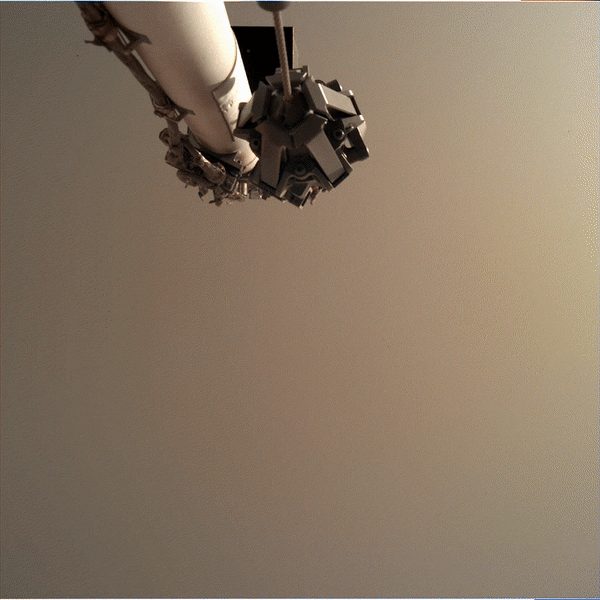 view from arm of InSight placing seismic instrument