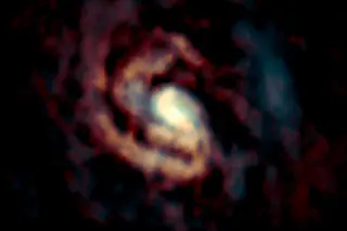 The distributions of CO molecular gas and C atomic gas are shown in orange and cyan, respectively. (Credit: ALMA (ESO/NAOJ/NRAO), Izumi et al.)