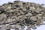 pile of ornate silver coins